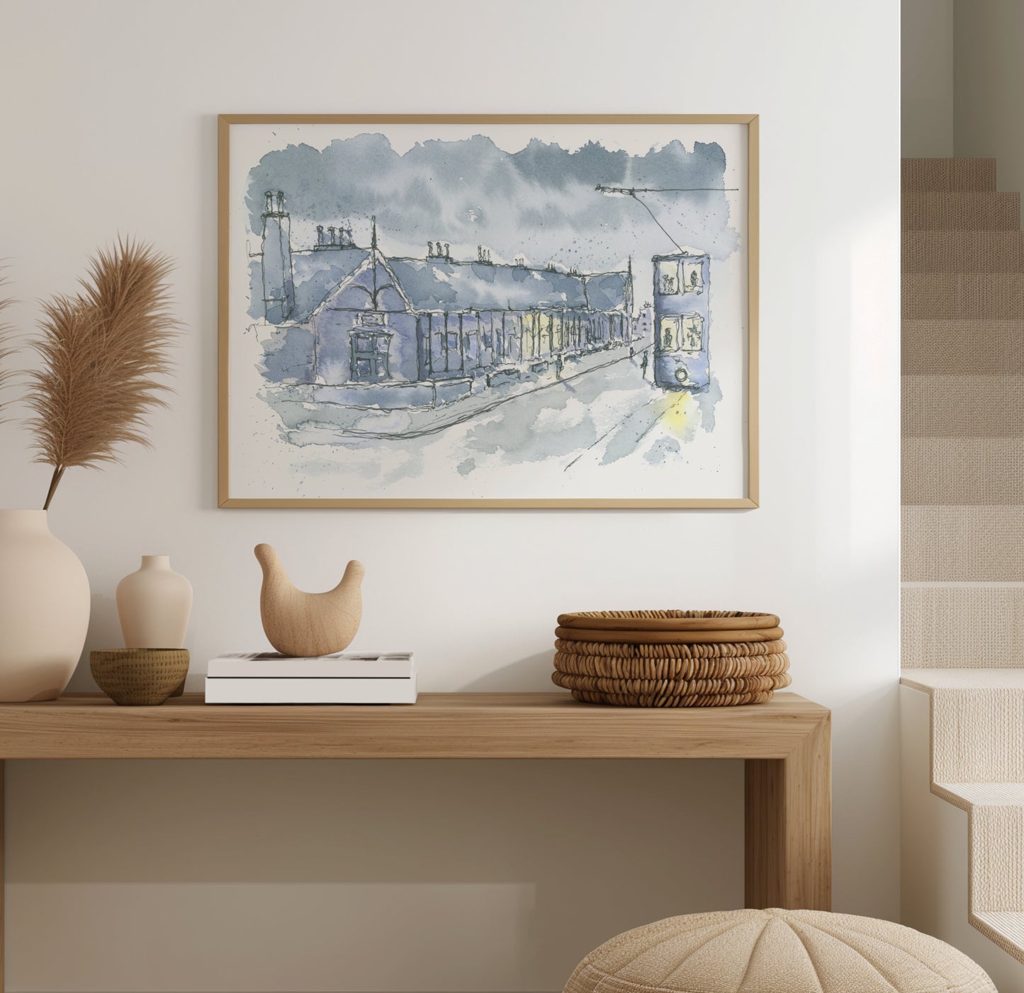 Watercolour painting of the Aged Miners' bungalows in Herrington shown framed on a wall