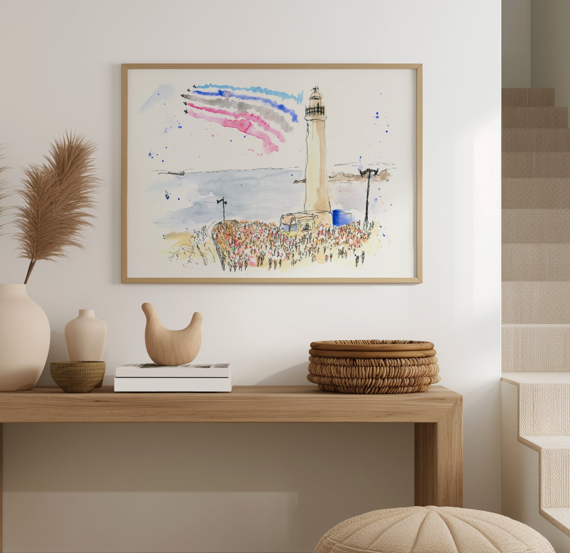 Sunderland International Airshow watercolour artwork displayed in a frame on a wall, showing the Red Arrows above a lively seafront scene, by Stephen Darling Art